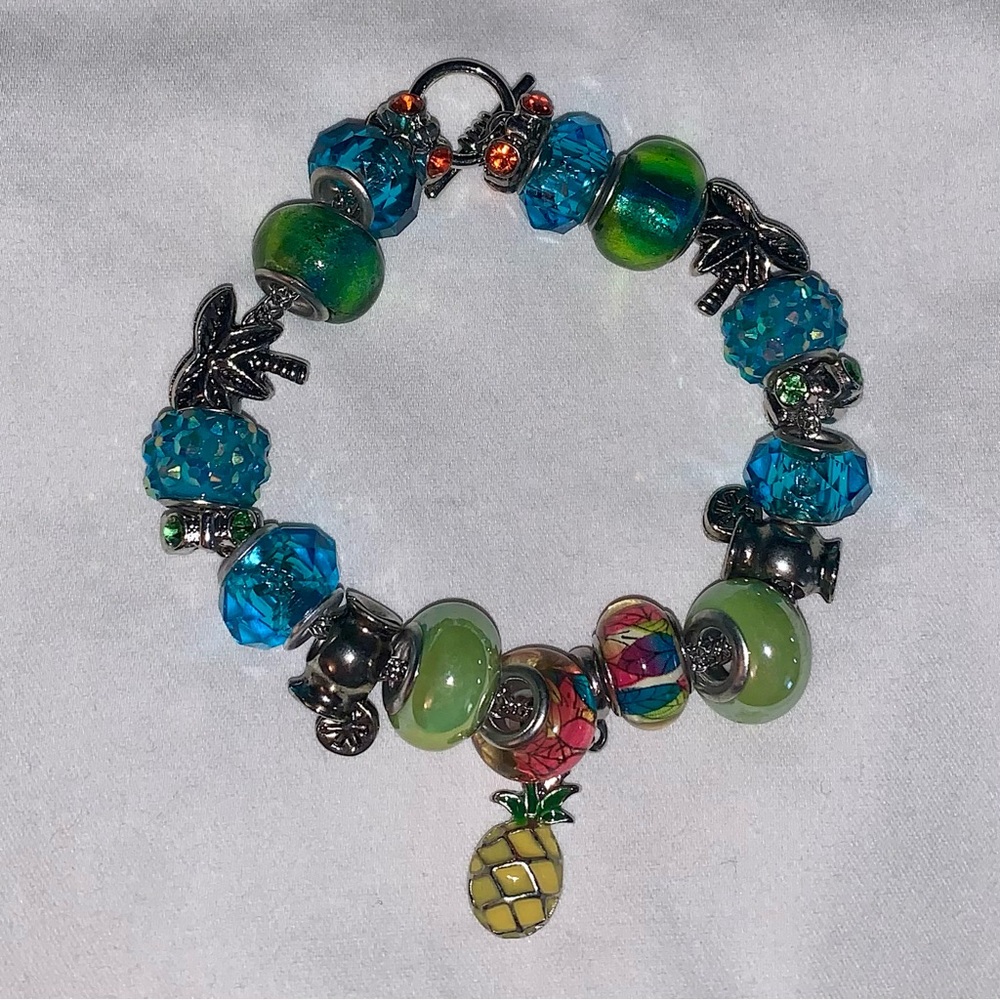 Handmade Bracelet, Springtime Theme. Made of Glass Beads, Charms, Crystal Beads.